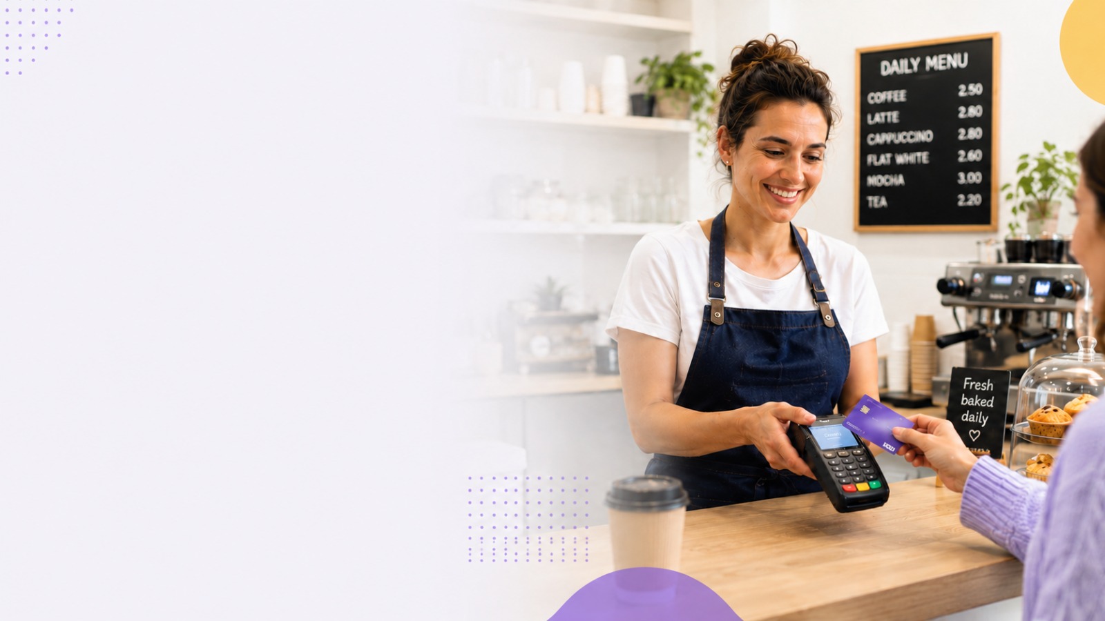 A UK business owner taking a card payment at the counter with a card terminal